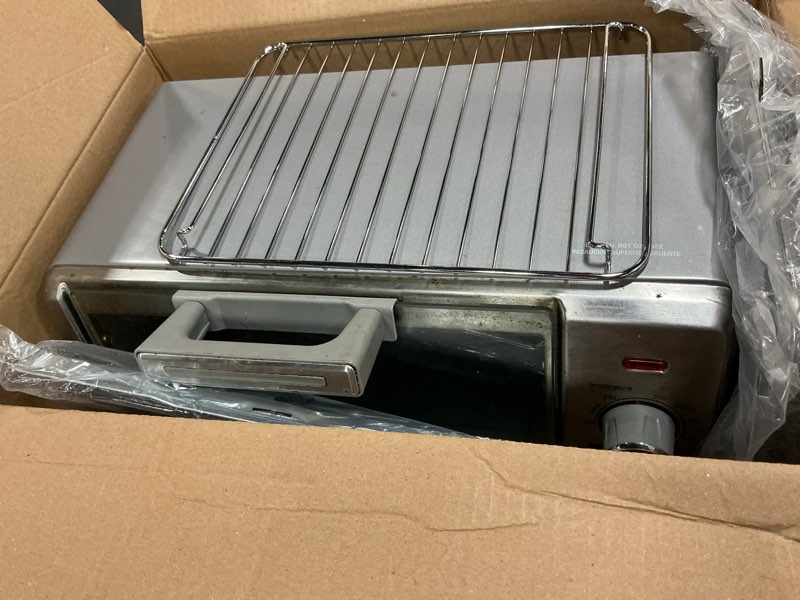 Condition photo showing As Is for black+decker crisp 'n bake air fry countertop convection toaster oven, medium capacity, 4-slice, 5-in-1, fits 9” pizza, 30-min timer, bake, broil, air fry, toast, keep warm, stainless steel