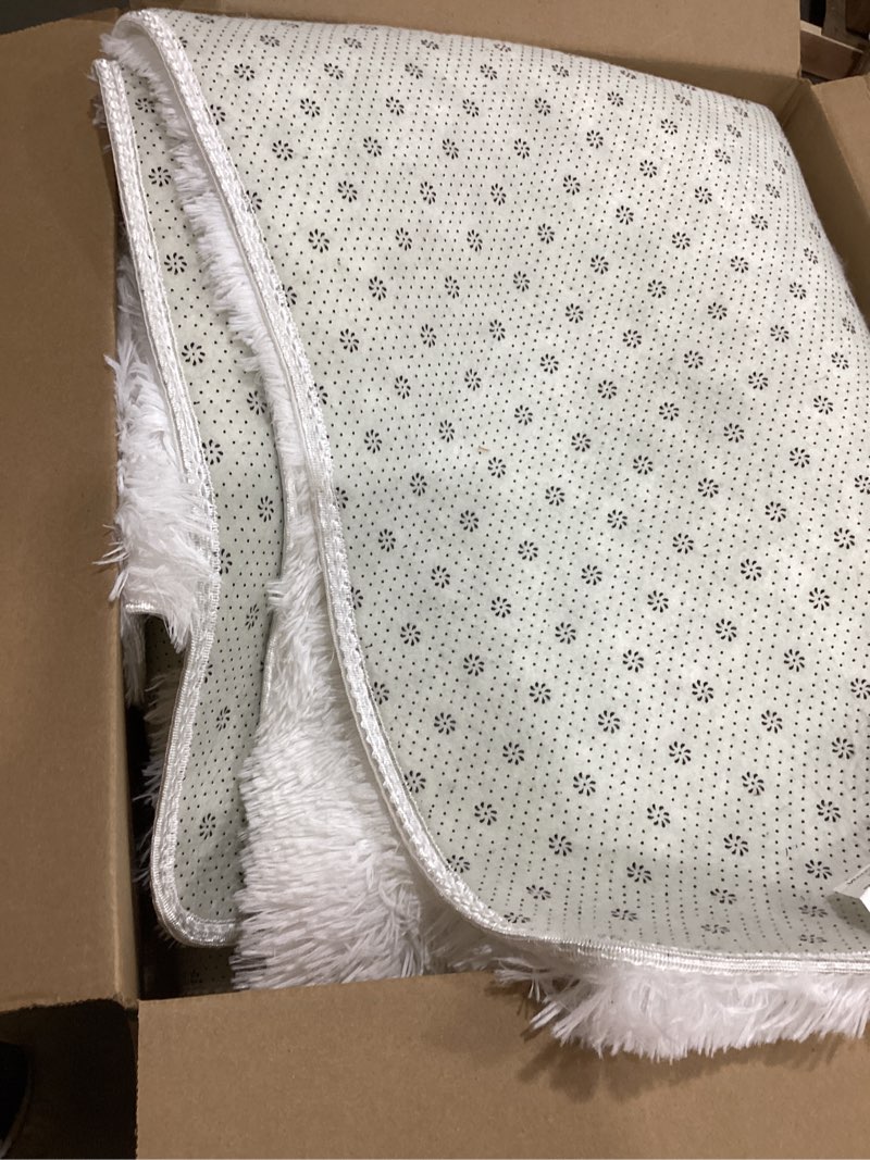 Condition photo showing Good Condition for olanly area rugs for living room bedroom, machine washable 4x5.9 ft soft fluffy shaggy bedside rug, indoor floor carpet for kids girls and boys, dorms, nursery rooms, home decor aesthetic, ivory 4x5.9 ft ivory