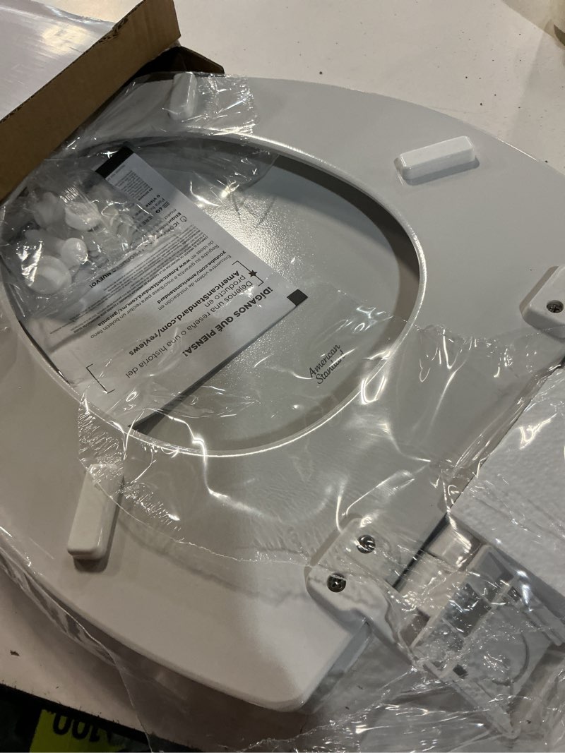 Condition photo showing Good Condition for american standard moments wood white elongated soft close toilet seat