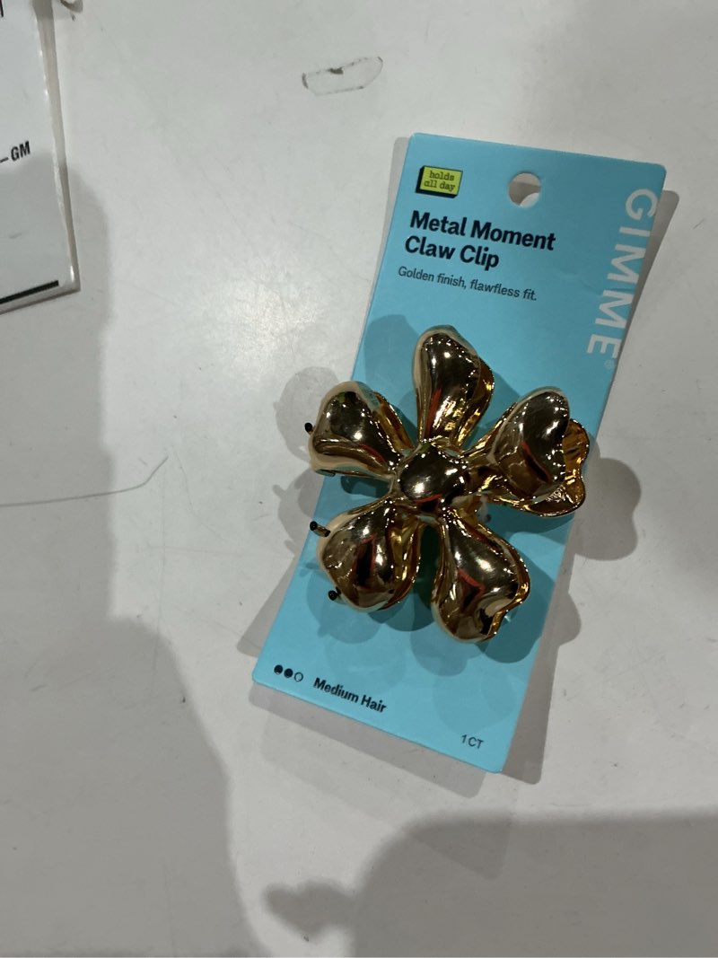 Condition photo showing Good Condition for gimme beauty gold metal flower claw clip for medium hair