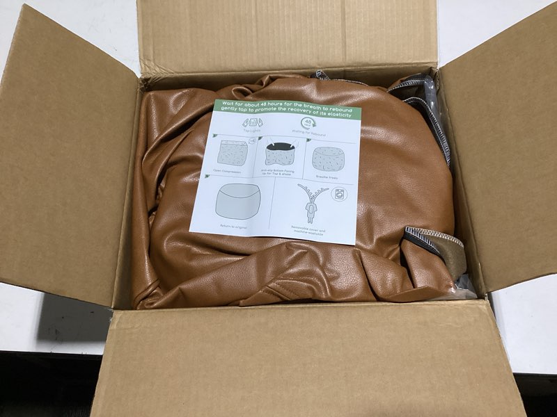 Condition photo showing Good Condition for HIGOGOGO Round Stuffed Pouf Ottoman, Pu Leather Poufs with Foam Chunk Filling Foot Stool Storage Ottoman, 26 X 18 Floor Poufs Foot Rest for Living Room, Brown 26 inch Brown