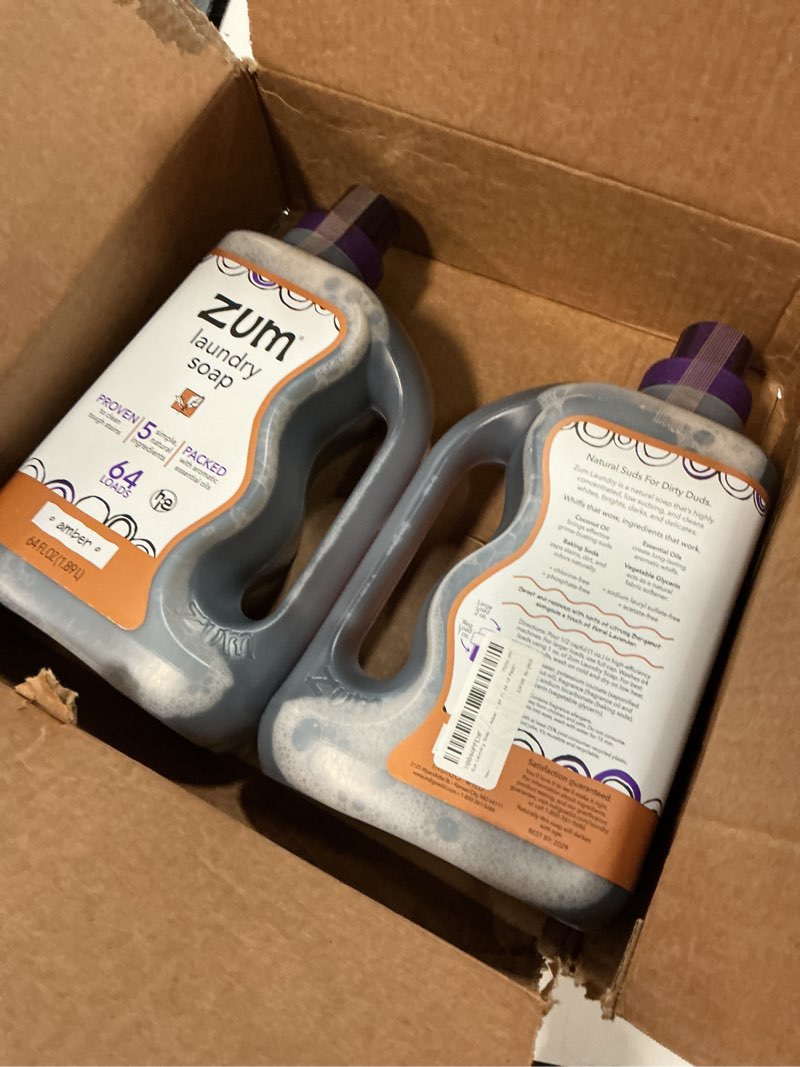 Condition photo showing New/Like New for exp-06/2029) zum laundry soap by indigo wild - liquid, plant-based soap with baking soda, essential oils, coconut oil & more - wash up to 64 loads - amber - 64 fl oz (2 pack)