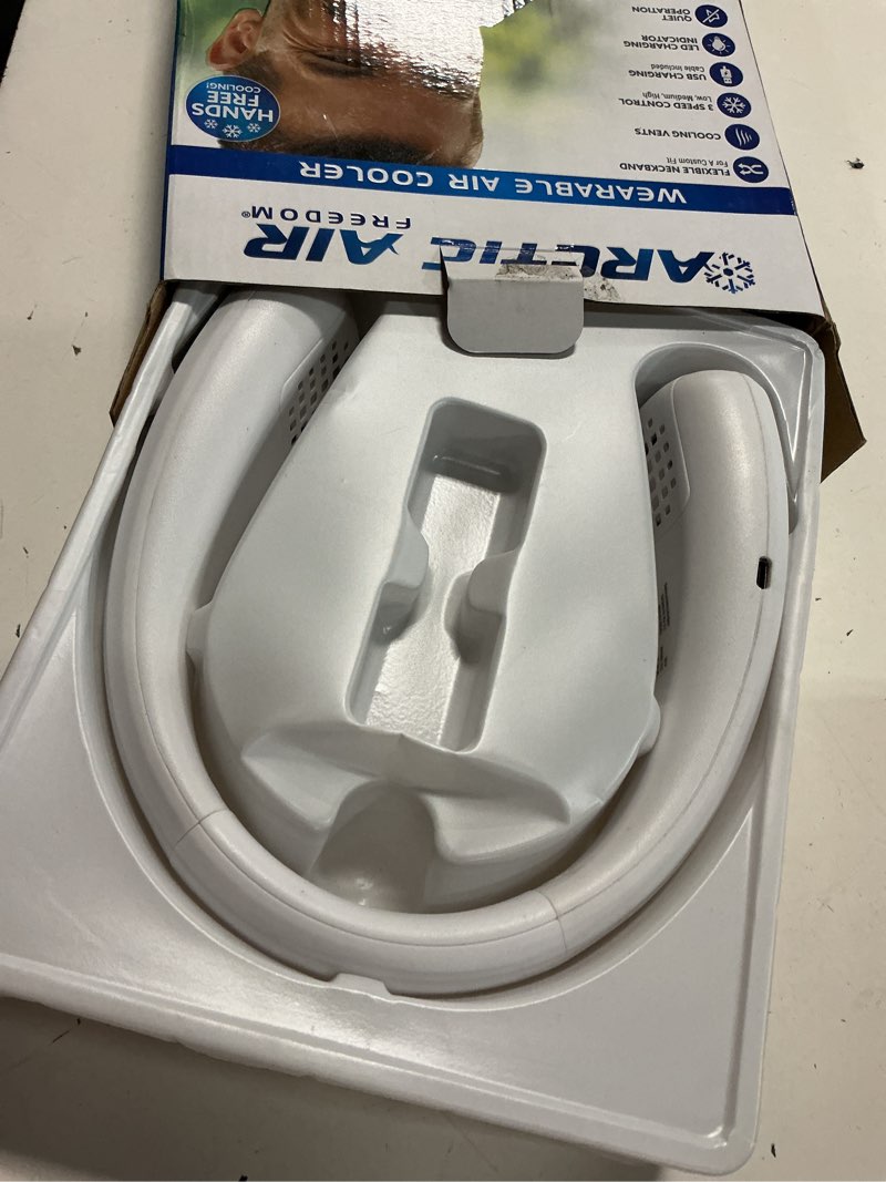 Condition photo showing As Is for arctic air freedom neck cooler, portable neck fan with 3 fan speeds, usb charging, 6-hour battery