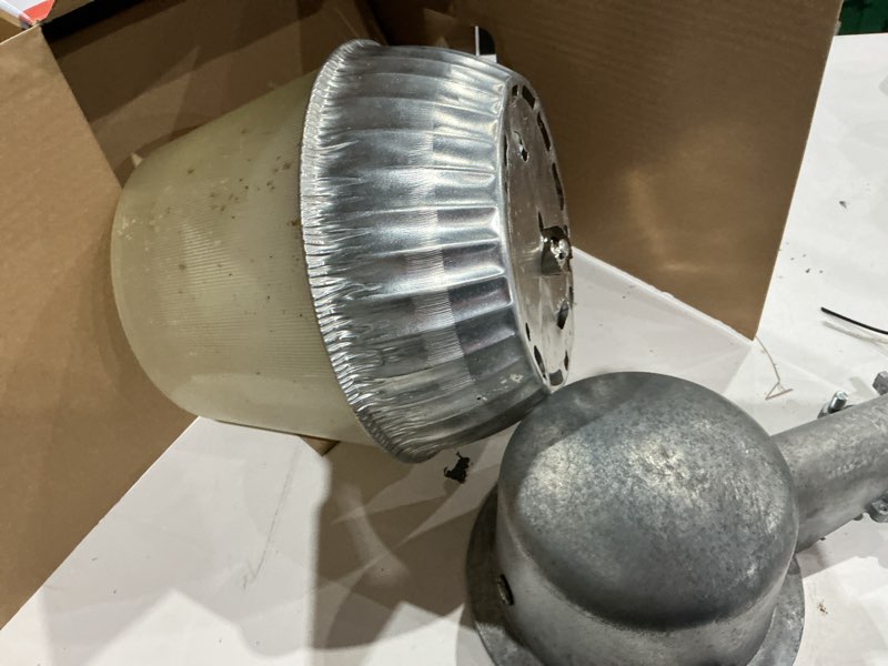 Condition photo showing As Is for oals10 35-watt led silver dusk to dawn area light