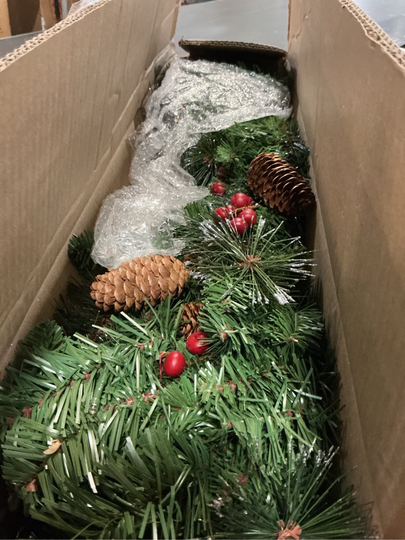 Condition photo showing Good Condition for national tree company 9 ft pre-lit crestwood spruce artificial christmas garland, christmas decoration with glitter, pinecones, red berries, 50 warm white led lights, 180 tips, timer, green battery operated tree