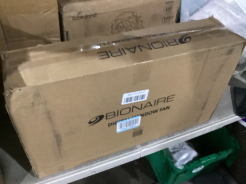 Condition photo showing New/Like New for bionaire window fan with reversible airflow blades – 3-speed settings, programmable thermostat, led display, remote control, fits 24–36" windows, no assembly required white 2 blades electronic control with lcd screen window fan