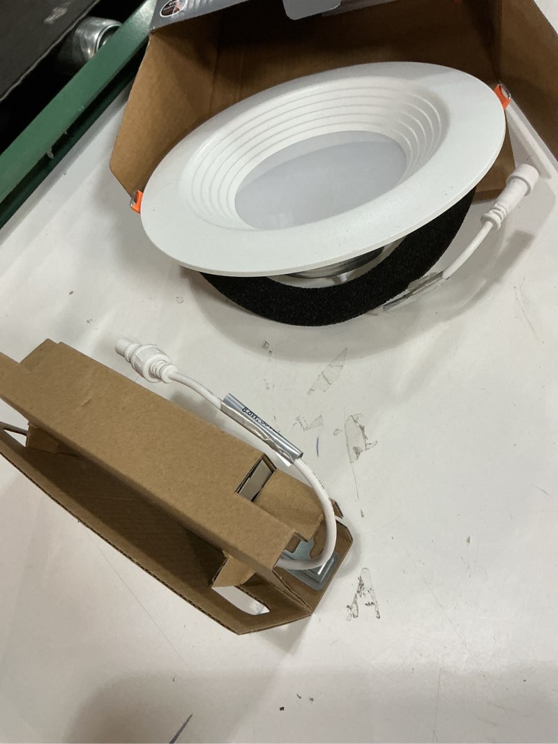 Condition photo showing As Is for halo matte white 6 in. w plastic led canless recessed downlight 8.5 w
