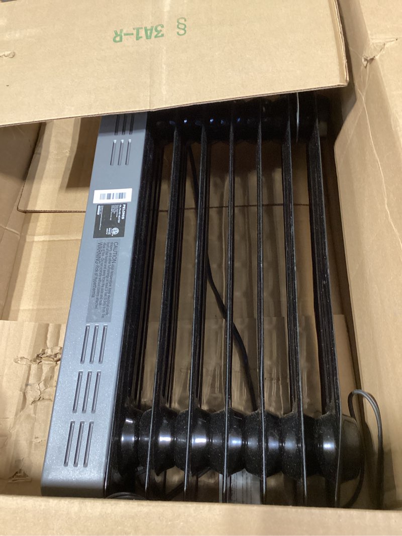 Condition photo showing As Is for pelonis oil filled radiator, electric space heater for indoor use large room with thermostat & remote, 3 modes & 3 heat settings, eco mode, 24h timer, quiet, overheat & tip-over protection, 1500w