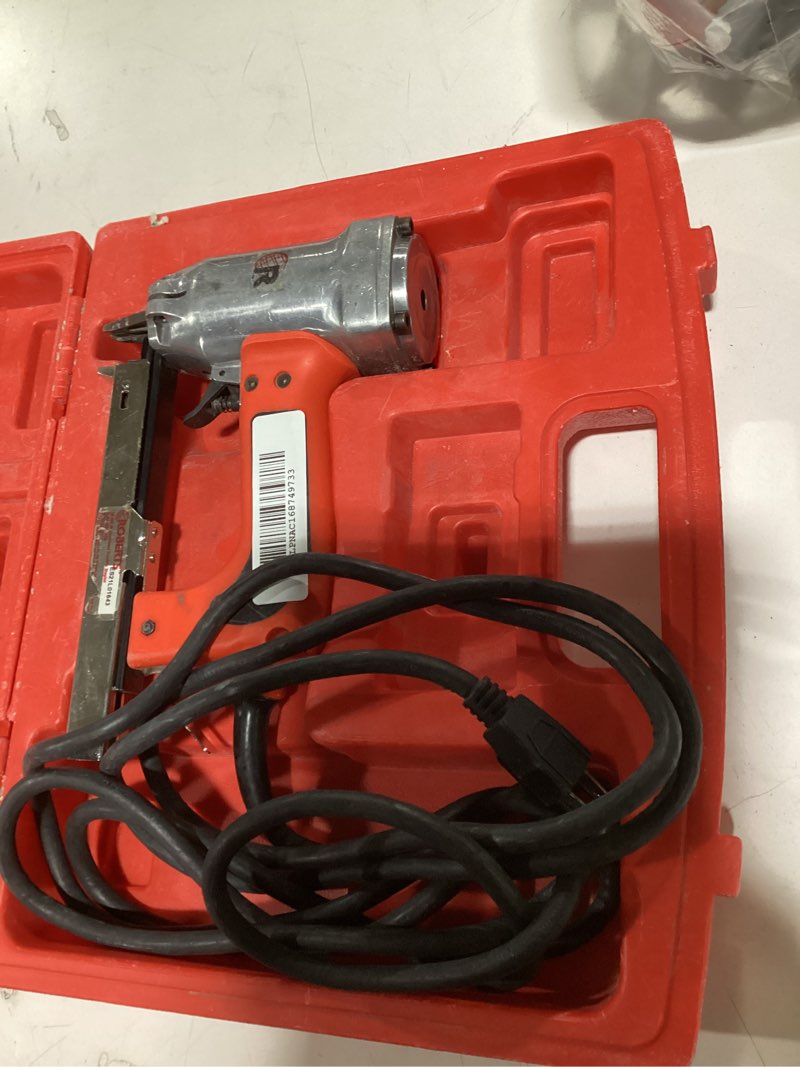 Condition photo showing As Is for roberts 10-600 3/16" crown, 120v, 15-amp, 20 gauge electric stapler with carrying case, red