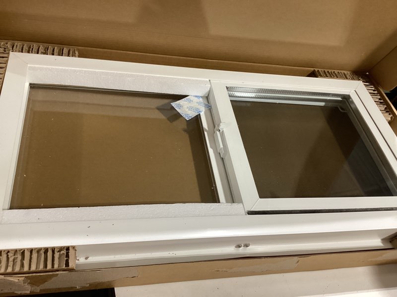 Condition photo showing New/Like New for left hand sliding vinyl window