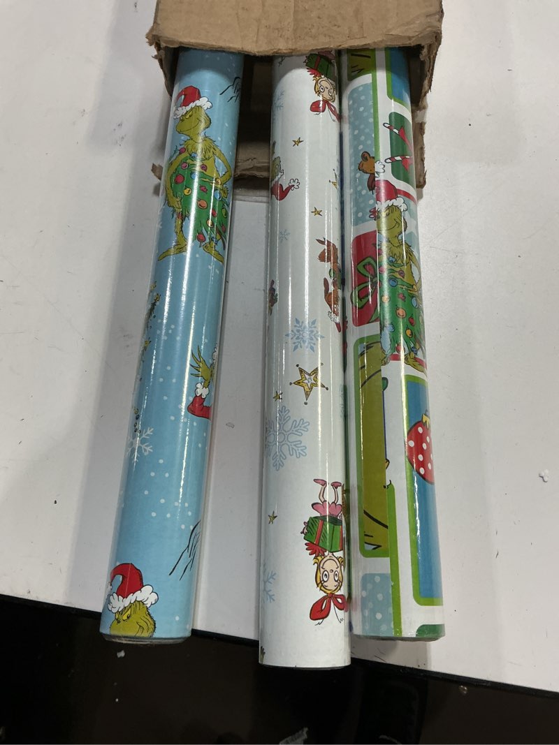 Condition photo showing Good Condition for Hallmark Christmas Peanuts Wrapping Paper with Cut Lines on Reverse (Pack of 3, 105 sq. ft. ttl) Snoopy, Charlie Brown, Woodstock (5JXW1036) Christmas Wrapping Paper