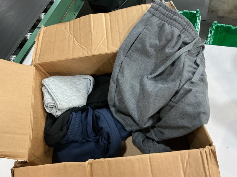 Condition photo showing As Is for set of 4 sweat pants, size large kids