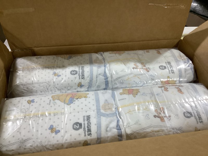 Condition photo showing As Is for huggies size 2 diapers, little snugglers baby diapers, size 2 (12-18 lbs), 84 count, packaging may vary size 2 84