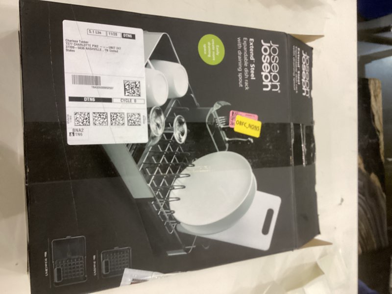 Expandable dish rack with draining spout