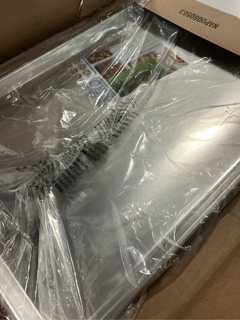 Condition photo showing item condition for Nordic Ware Extra Large Baking Sheet, 21 x 15 inches, XL Big sheet pan Natural Uncoated Aluminum, Reinforced Steel Rim Prevents Warping, 1pk Big Sheet