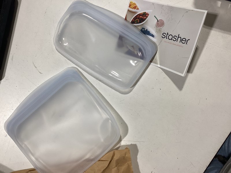 Condition photo showing As Is for incomplete stasher silicone reusable food storage bags, 4-pack, reusable freezer bags, microwave, dishwasher, oven safe, sous vide, premium lunch containers, eco friendly, snack bags, food-safe silicone, clear | reusable food bags
