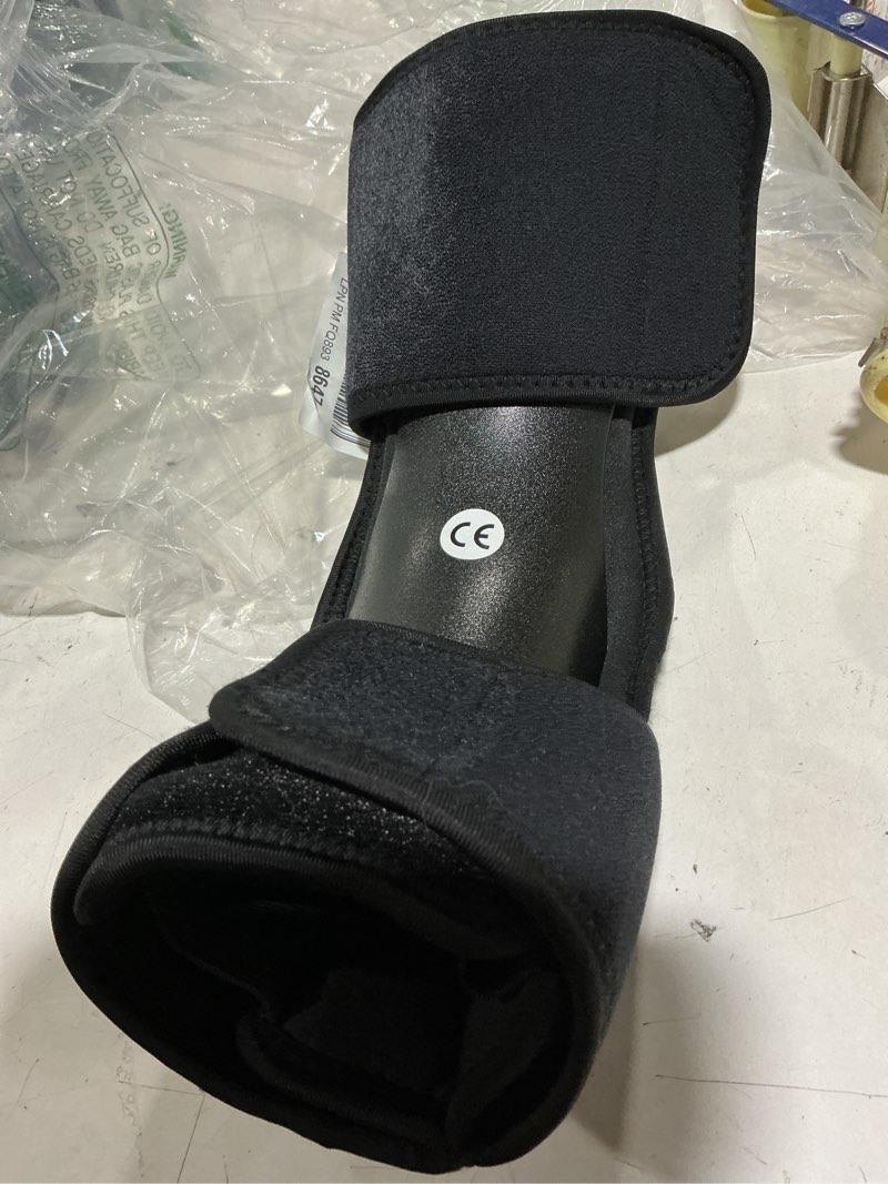 Condition photo showing Good Condition for this rolyan dorsal night splint features a black, soft-padded design with velcro straps for treating plantar fasciitis