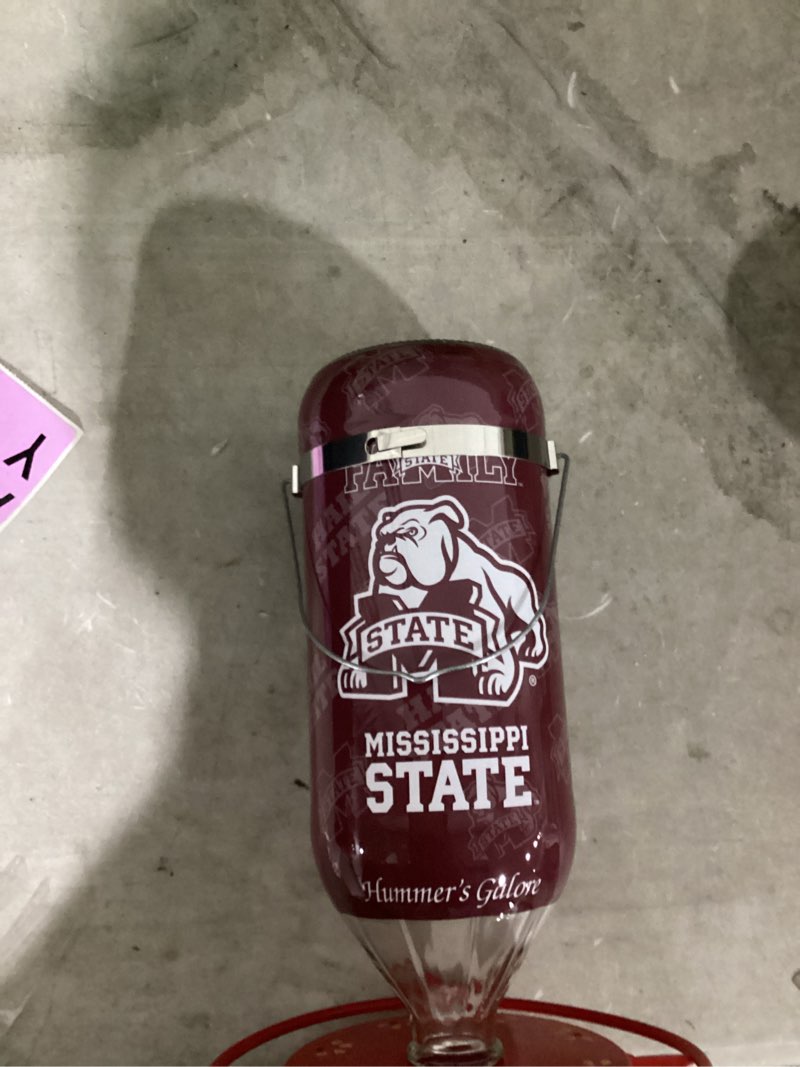 Condition photo showing Good Condition for (Similar To)Hummer's Galore, NCAA College Football Hummingbird Feeder, Glass Hummingbird Feeder with UV Resistant Plastic Wrap for Outdoors Hanging, 32 oz, (Texas A&M) (Mississippi State)