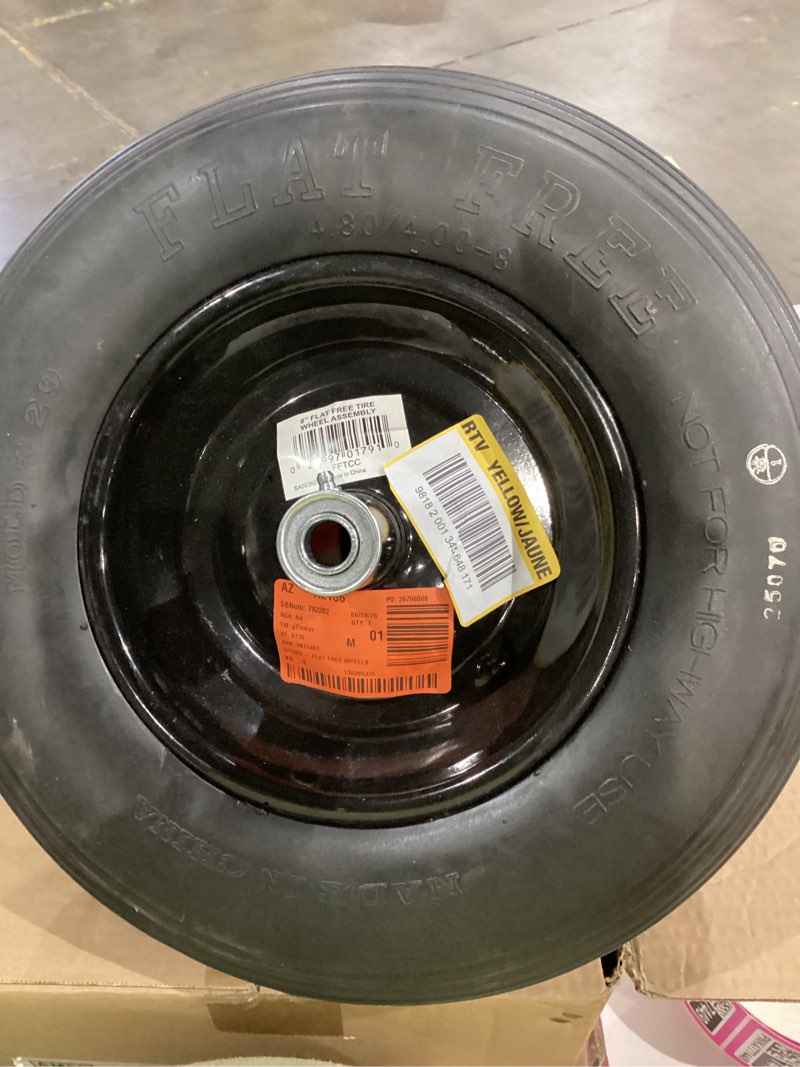 Condition photo showing As Is for flat-free wheelbarrow tire