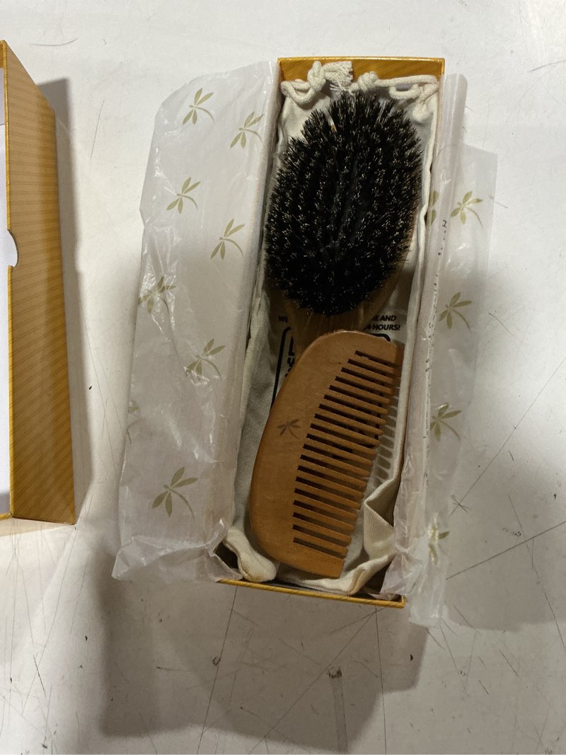 Condition photo showing New/Like New for belula 100% boar bristle hair brush set (medium). soft natural bristles for thin and fine hair. restore shine and texture. wooden comb, travel bag and spa headband included!