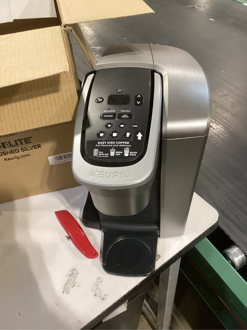 Condition photo showing As Is for keurig k-elite single serve k-cup pod coffee maker, with strength and temperature control, iced coffee capability, 8 to 12oz brew size, programmable, brushed silver