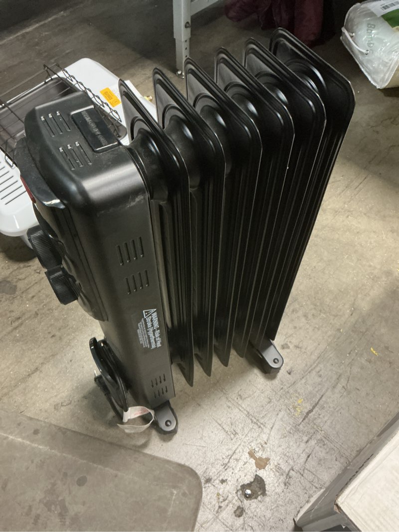 Condition photo showing As Is for  Utilitech 1500 -Watt Oil-filled radiant Utility Indoor Electric Space Heater with Thermostat