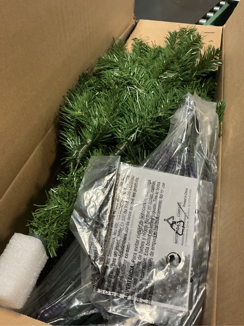 Condition photo showing Good Condition for National Tree Company 6.5 ft Unlit North Valley Spruce Slim Artificial Christmas Tree, 832 Tips, Includes Stand, Green