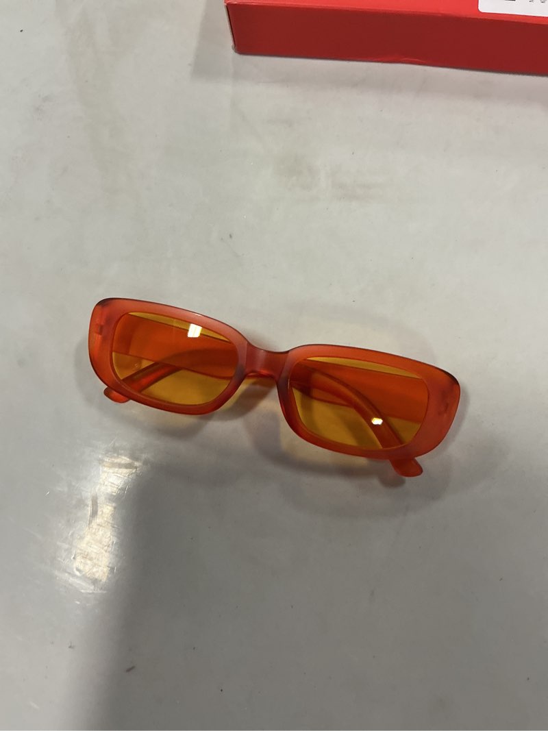 Miyya retro, rectangular sunglasses with an orange plastic frame and orange lenses