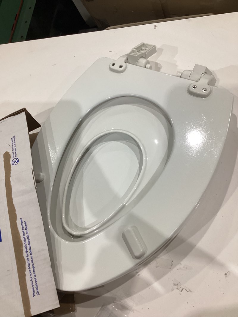 Condition photo showing As Is for mayfair by bemis nextstep2 wood white elongated soft close toilet seat