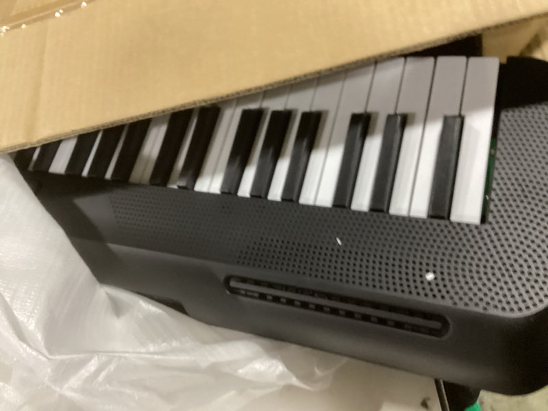 Condition photo showing As Is for (SIMILAR TO STOCK PHOTO)Amazon Basics Electric Keyboard Piano with 61 Keys, Built-in Speakers, Songs for Learning, Black