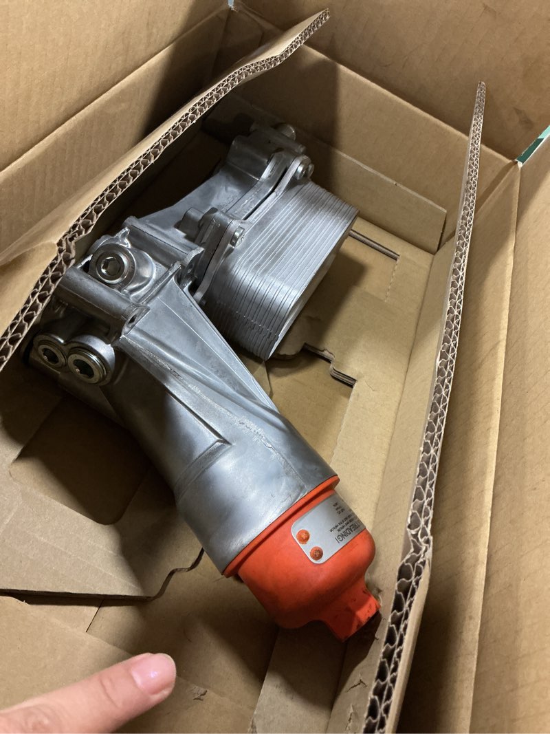 Condition photo showing As Is for Dorman 926-959 Patented Upgraded Aluminum Engine Oil Filter Housing with Oil Cooler and Filter Compatible with Select Models (OE FIX)