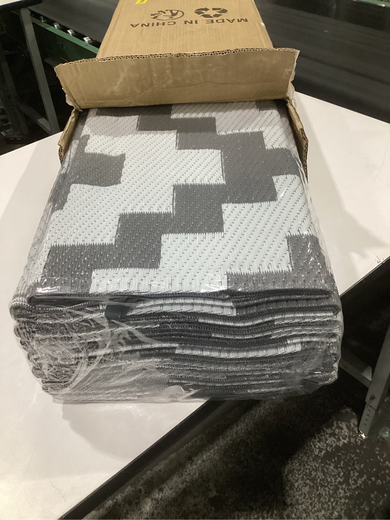 Condition photo showing Good Condition for olanly waterproof outdoor rug 9x18 ft, outdoor plastic straw rug for camping, rv mat outside, outdoor carpet for porch, deck, backyard, balcony, picnic, grey & white grey & white geometric 9' x 18' (rectangular)