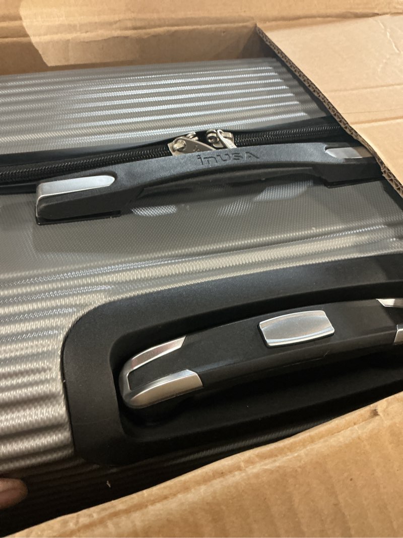 Condition photo showing Good Condition for inusa royal hardside spinner luggage with ergonomic handles | spacious travel suitcase with four spinner wheels and studs | 32 inch extra large spinner luggage | silver 32 inch (xl) silver