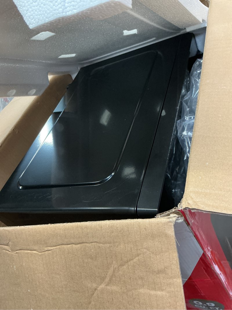 Condition photo showing As Is for Frigidaire Black with Chrome 0.9 Cubic Foot Microwave