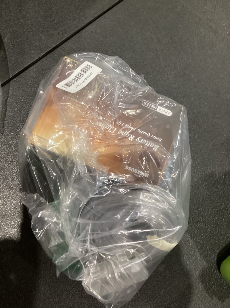 Condition photo showing As Is for JMEXSUSS 2 Pack Christmas Lights Battery Operated Rope Lights Outdoor Waterproof Total 200LED 8 Modes Battery Powered String Lights with Remote for Car Trampoline Tree Christmas Decor (Multicolor) 2*100LED Multicolor