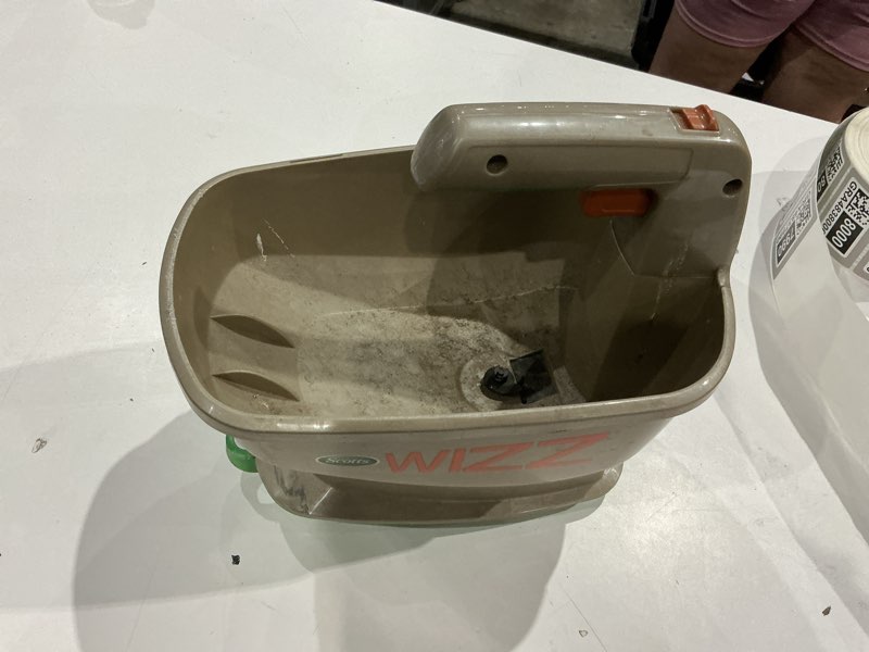 Condition photo showing As Is for scotts wizz 60 in. w handheld spreader for fertilizer/ice melt/seed 4 lb