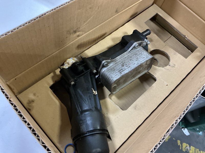 Condition photo showing As Is for Dorman 926-959 Patented Upgraded Aluminum Engine Oil Filter Housing with Oil Cooler and Filter Compatible with Select Models (OE FIX)