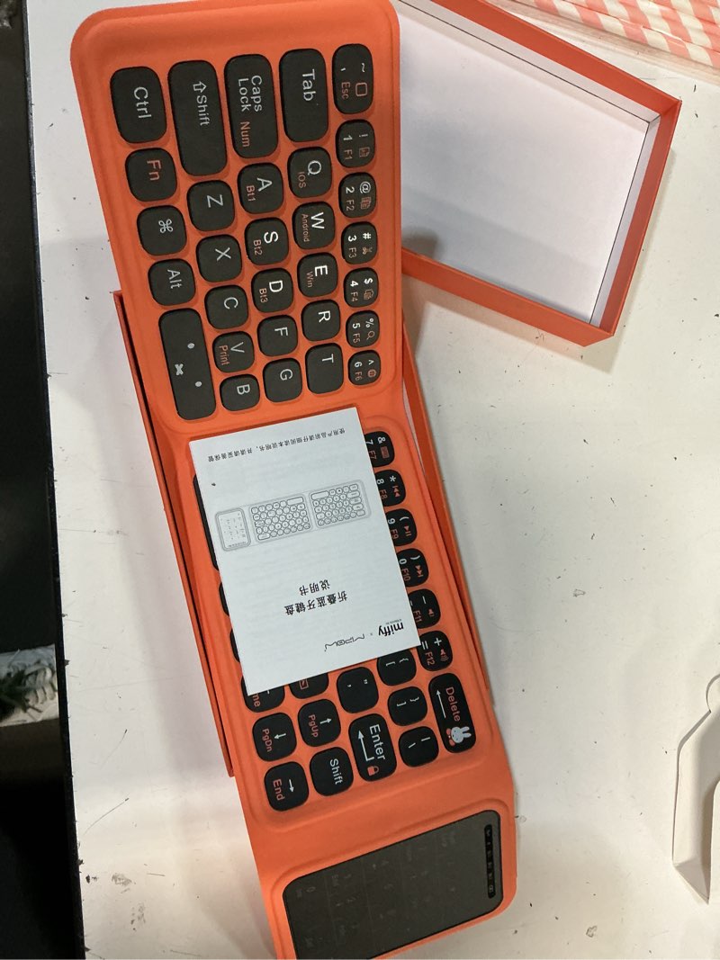 Condition photo showing Good Condition for miffy triple-fold bluetooth keyboard - magnetic fold design with integrated touchpad & numeric keypad, bluetooth 5.0 (3 devices), rechargeable 5.6mm slim, premium leather - orange