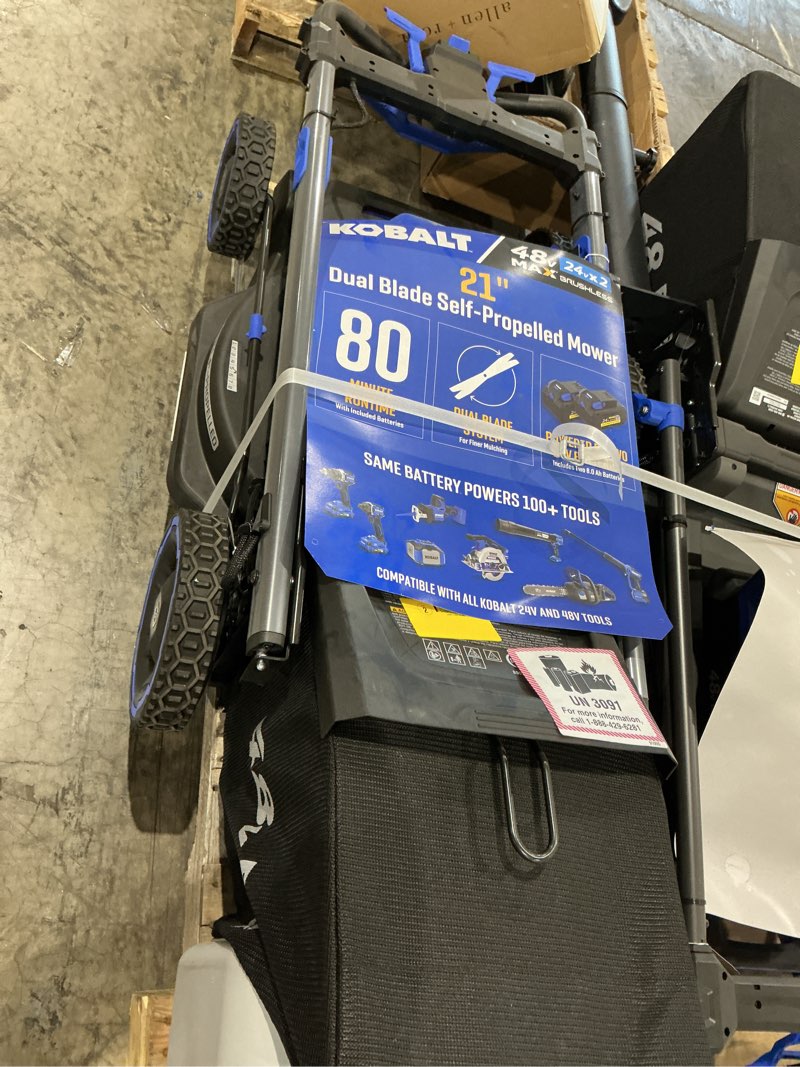 Condition photo showing As Is for kobalt 48v max (24vx2) 21-in dual blade self-propelled mower kit, (2) 8.0ah batteries and charger