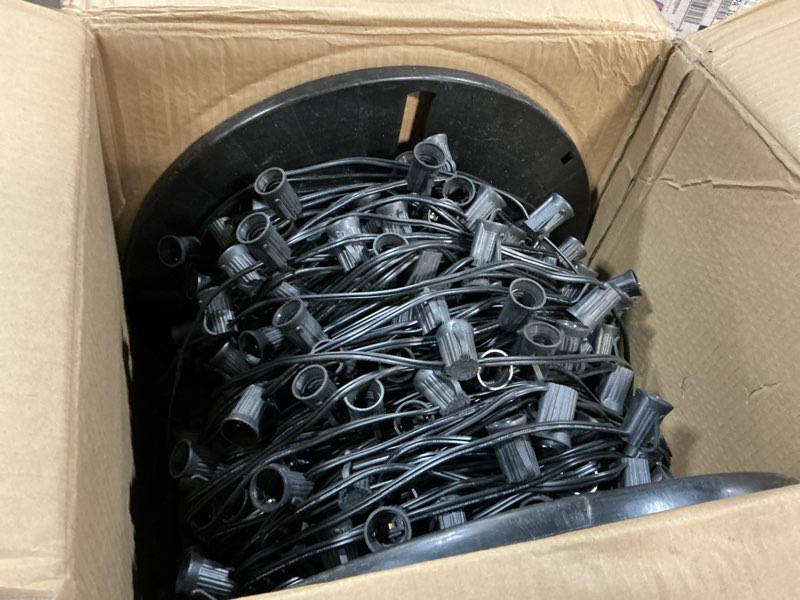 Condition photo showing As Is for Brightown Commercial 500FT C9 Christmas Stringer Bulk Reel, C9 Light Sockets Set Spool with 12" Spacing, UL Listed Christmas Roof Lights Cord, SPT-1 8-Awg, Black C9-Black Wire 500FT