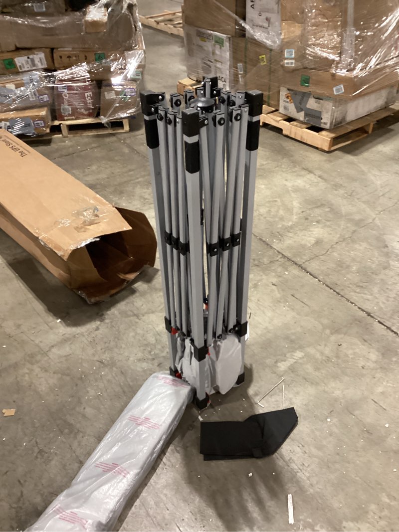 Condition photo showing As Is for Amazon Basics Outdoor Pop Up 10 x 10 Canopy Tent for Events, Portable with Easy Setup, One-Push, Includes Wheeled Carry Bag, 8 Pegs, 4 Ropes, 4 Weighted Bags, White One-Push Pop Up White