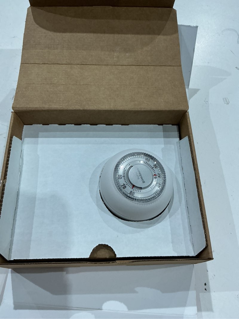 Condition photo showing As Is for honeywell home manual heat only thermostat