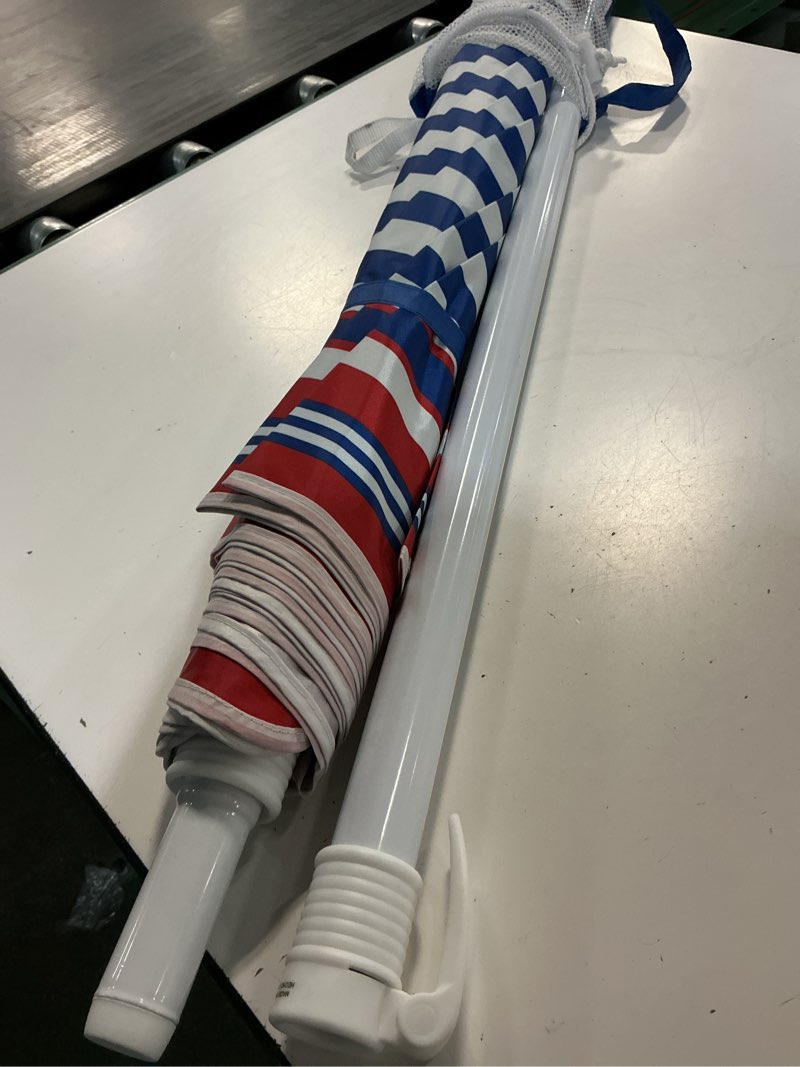 Condition photo showing As Is for mainstays 6.5' red blue white stripe octagon beach umbrella, tilt