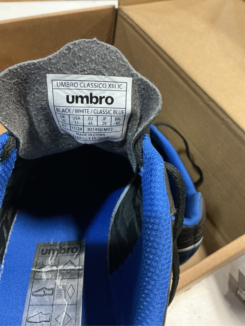 Condition photo showing As Is for umbro men's classico 13 indoor 11 black/white/royal