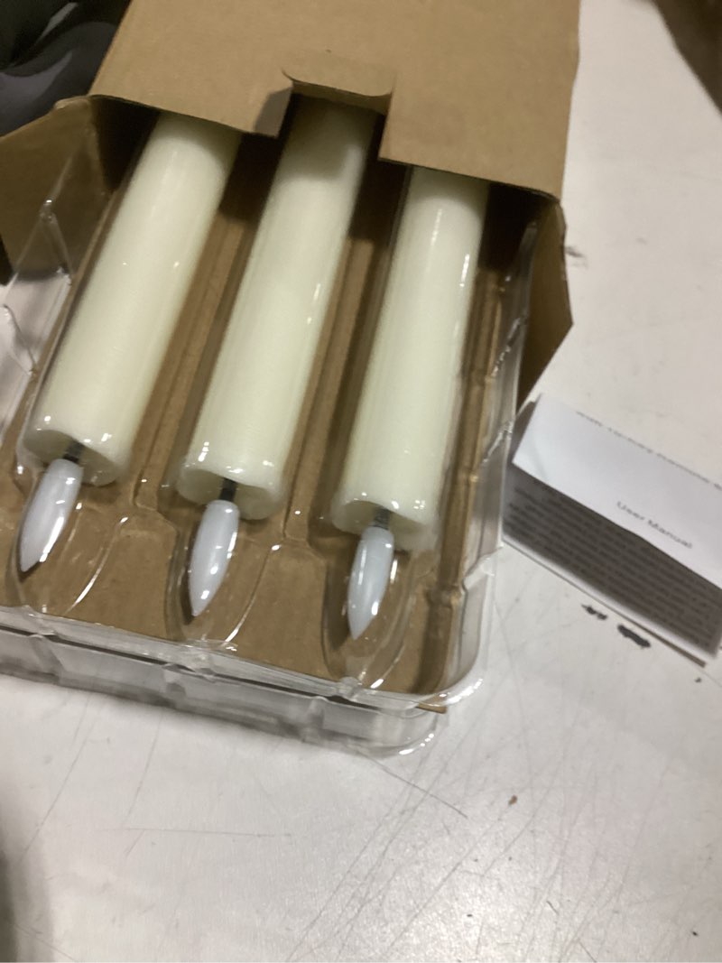 Condition photo showing Good Condition for genswin flameless ivory taper candles flickering with 10-key remote, battery operated led warm 3d wick light window candles real wax pack of 6, christmas home wedding decor(0.78 x 9.64 inch) 6-ivory
