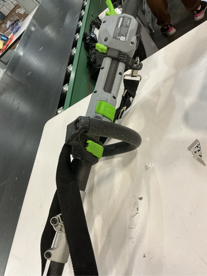 Condition photo showing As Is for ego power + powerload with line iq 56-volt 16-in telescopic shaft battery string trimmer 4.0 ah (battery included) (charger included)