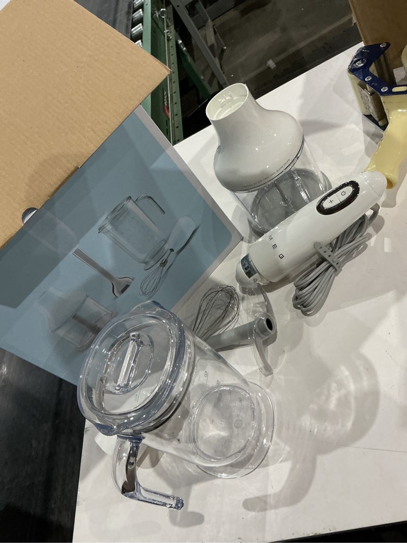 Condition photo showing Good Condition for smeg handheld immersion blender with beaker, chopping bowl w/lid, wire whisk, 5 speed controls, made with stainless steel blades and ergonomic design (pastel blue)