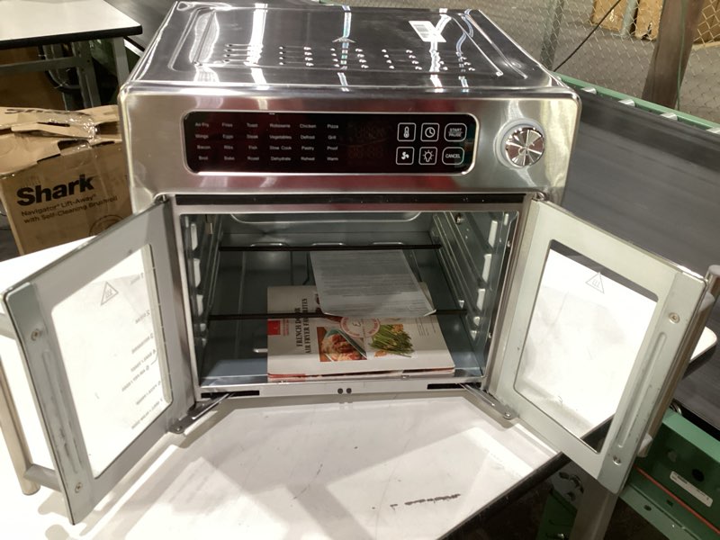 Condition photo showing Good Condition for Dan - Emeril Lagasse Extra Large French Door Air Fryer Toaster Oven Combo, 24 Cooking Functions and Digital Controls, 7 Accessories Included, Stainless Steel Finish, 26QT Capacity, SLIGHTLY DENTED, NOT TESTED