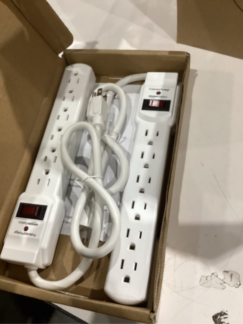 Condition photo showing Good Condition for Amazon Basics Surge Protector Power Strip, 6-Outlet with 200J Protection, 2ft Extension Cord, Rectangle, White (2 Pack) 200 Joule White 2 Pack