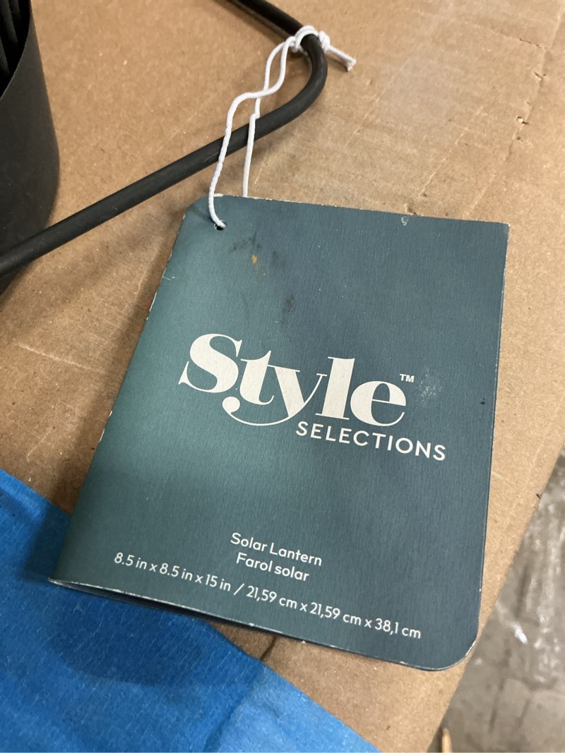 Condition photo showing As Is for Style Selections 6.5-in x 10.5-in Black Metal Solar Outdoor Decorative Lantern one